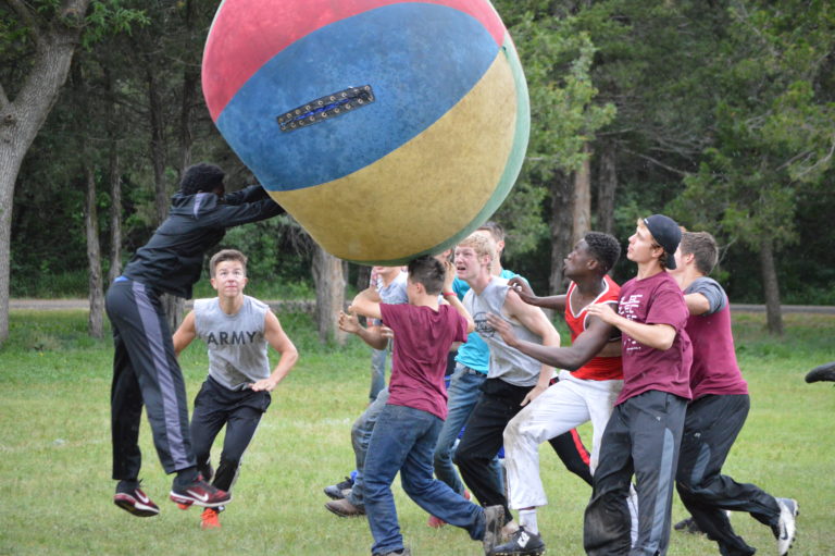 Boys playing jumbo ball